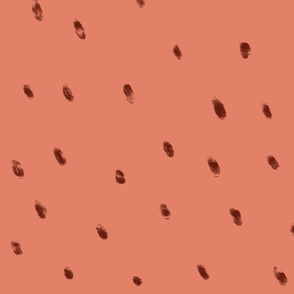 sparse dots brown on muted coral 