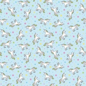 Rainbow Unicorns and Stars, scattered on light blue – small scale