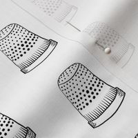 Thimbles on White Sewing Notions Thimble 