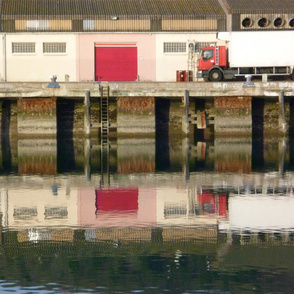 Reflections in Red at a Quiet Port