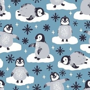 Cute penguins. Blue background