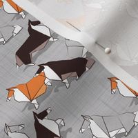 Tiny scale // Origami Collie friends // grey linen texture background white orange & brown paper and cardboard dogs