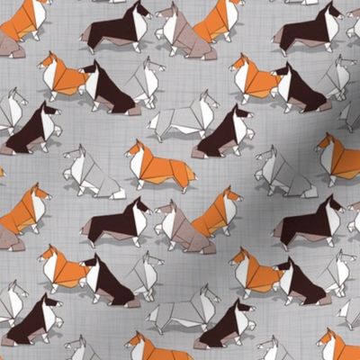 Tiny scale // Origami Collie friends // grey linen texture background white orange & brown paper and cardboard dogs