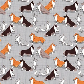 Tiny scale // Origami Collie friends // grey linen texture background white orange & brown paper and cardboard dogs