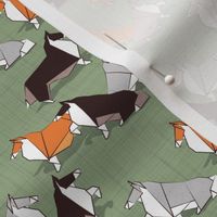 Tiny scale // Origami Collie friends // sage green linen texture background white orange & brown paper and cardboard dogs