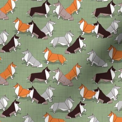 Tiny scale // Origami Collie friends // sage green linen texture background white orange & brown paper and cardboard dogs