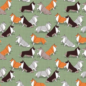 Tiny scale // Origami Collie friends // sage green linen texture background white orange & brown paper and cardboard dogs