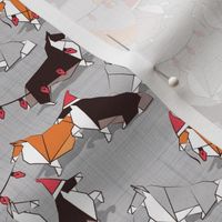 Tiny scale // Origami Christmas Collie friends // grey linen texture background white orange & brown paper and cardboard dogs red ornaments
