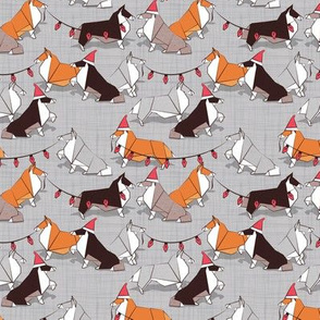 Tiny scale // Origami Christmas Collie friends // grey linen texture background white orange & brown paper and cardboard dogs red ornaments