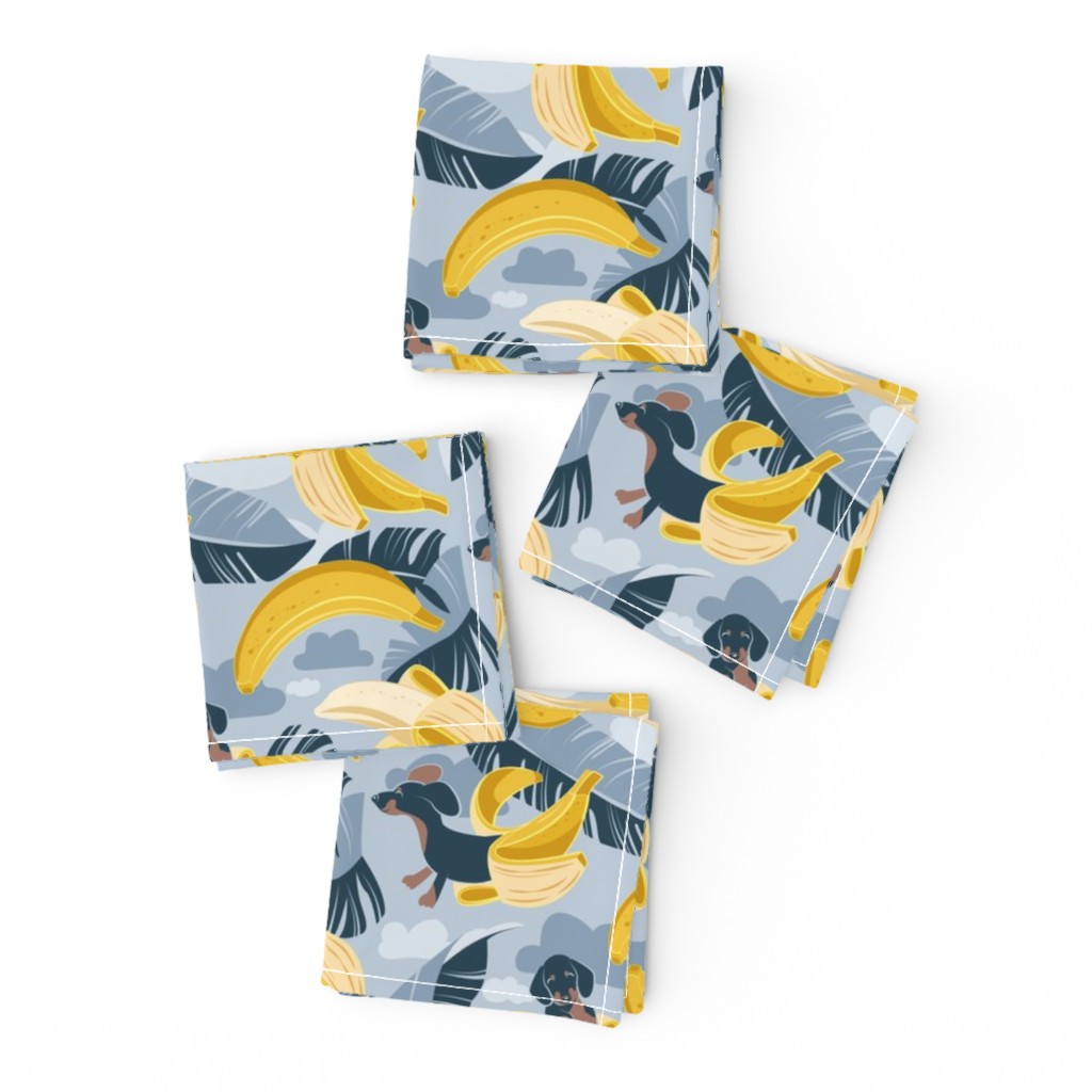 Small scale // Surrealistic tropical Dachshund bananas // pastel blue background navy blue dogs and banana fruit leaves