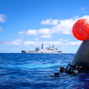 62-7 USS Anchorage, in background, conducting the first exploration flight test for the NASA Orion Program.