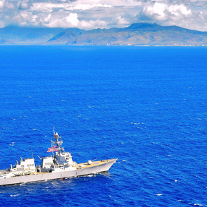  62-13 USS Chafee flies the U.S. Navy battle ensign while performing maneuvers off the coast of Hawaii