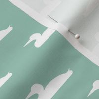 Small abstract loon silhouette - white on mint
