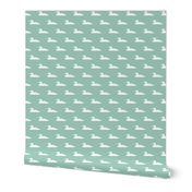 Small abstract loon silhouette - white on mint