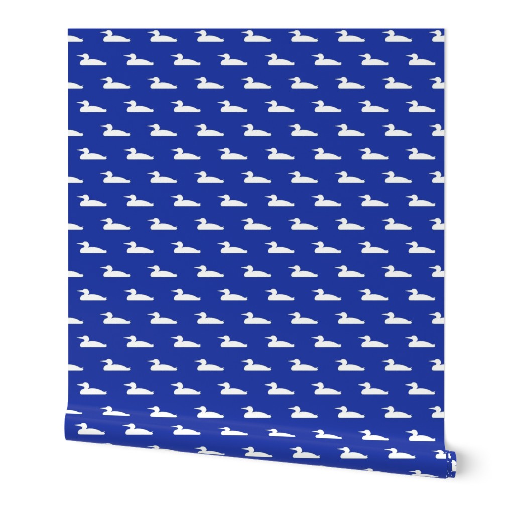 Small abstract loon silhouette - white on morning blue