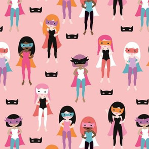 Colorful super hero girls with mask and cape fun heroine theme for kids pink