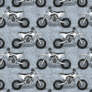 Small scale // Motocross // monochromatic pastel blue background and motorcycles 