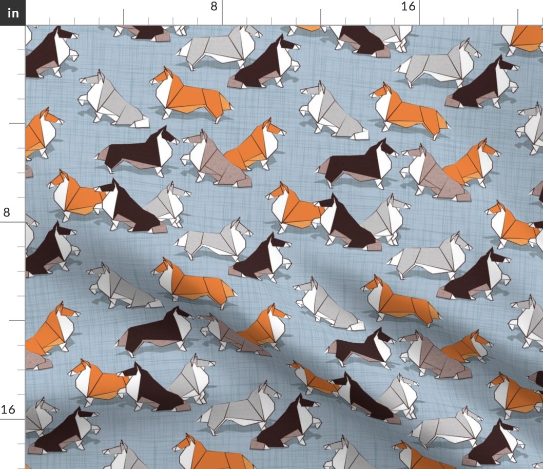 Small scale // Origami Collie friends // pastel blue linen texture background white orange & brown paper and cardboard dogs