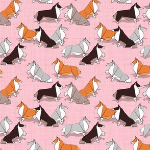 Tiny scale // Origami Collie friends // pastel pink linen texture background white orange & brown paper and cardboard dogs