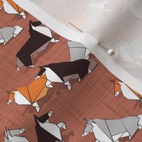 Tiny scale // Origami Collie friends // brown siena linen texture background white orange & brown paper and cardboard dogs