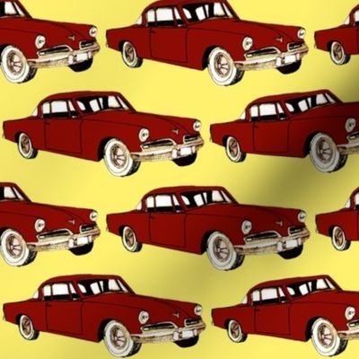 Big red 1953 Studebaker on yellow background