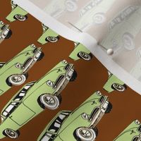 Green 1953 Studebaker Starliner on cocoa background (straight rows)