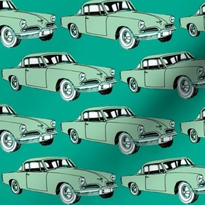 Big aqua 1953 Studebaker on teal background