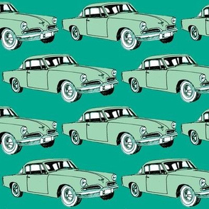 Big aqua 1953 Studebaker on teal background