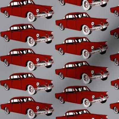 Big red 1953 Studebaker on gray background