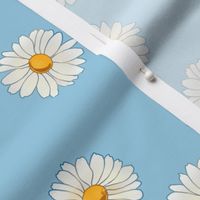 daisies on pastel blue
