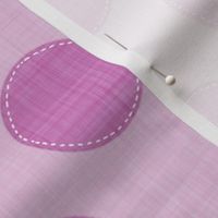 Magenta polka dots with stitch-like details on a pink fabric texture.