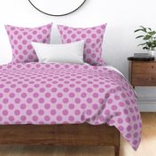 Magenta polka dots with stitch-like details on a pink fabric texture.