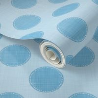 Whimsical dotted blue circles on a linen-styled background.