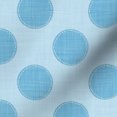 Whimsical dotted blue circles on a linen-styled background.