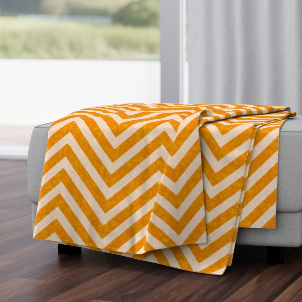 Warm orange chevrons weave a lively zigzag pattern with a cozy, textured appeal.