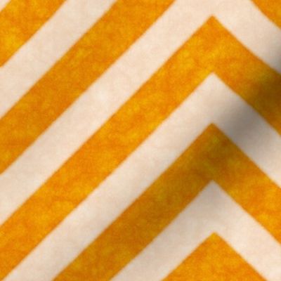 Warm orange chevrons weave a lively zigzag pattern with a cozy, textured appeal.