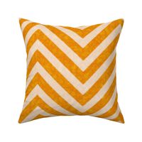 Warm orange chevrons weave a lively zigzag pattern with a cozy, textured appeal.