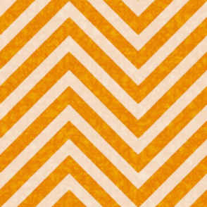 Warm orange chevrons weave a lively zigzag pattern with a cozy, textured appeal.