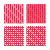 "Core" Small geometric, red polkadots on white.