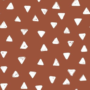small sketch triangles on rust red