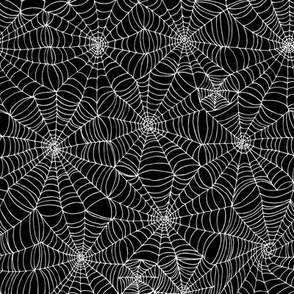 Spiderwebs -   White on black, small scale