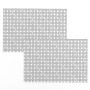 "Core" Small geometric, light gray polkadots on white.