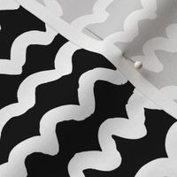 White on black looping painterly squiggles