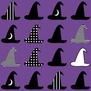 Small Halloween witch hats black and white on purple