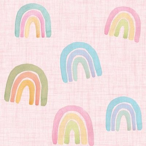watercolor pastel scattered rainbows on pink linen