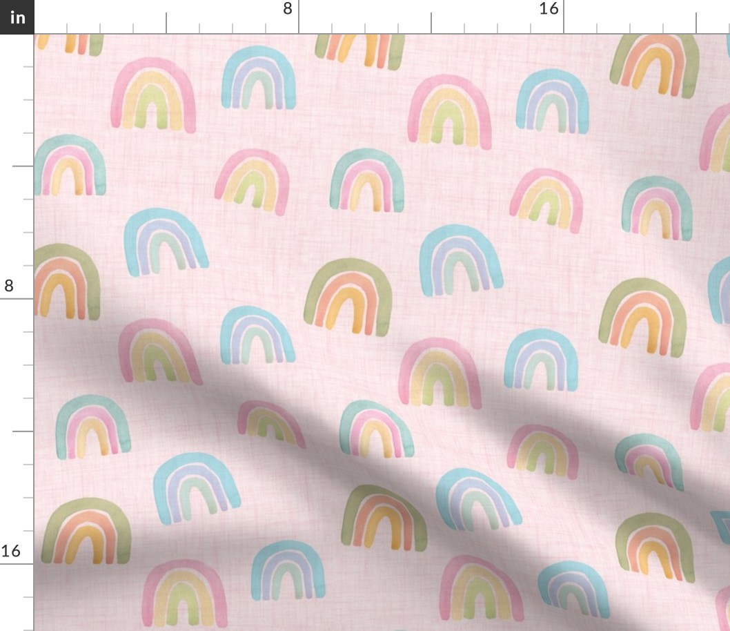 watercolor pastel scattered rainbows on pink linen