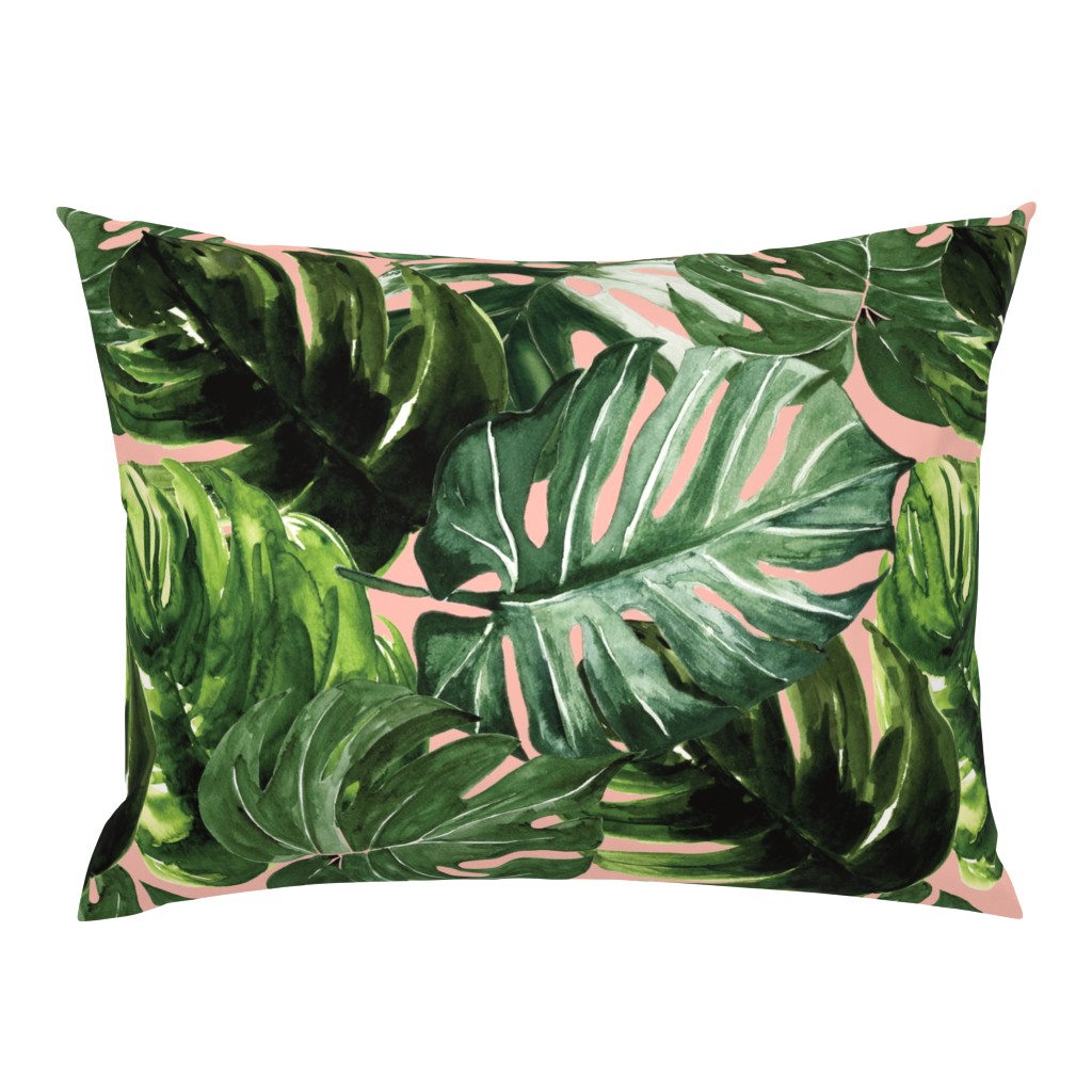 monstera tropical leaves on peach pink