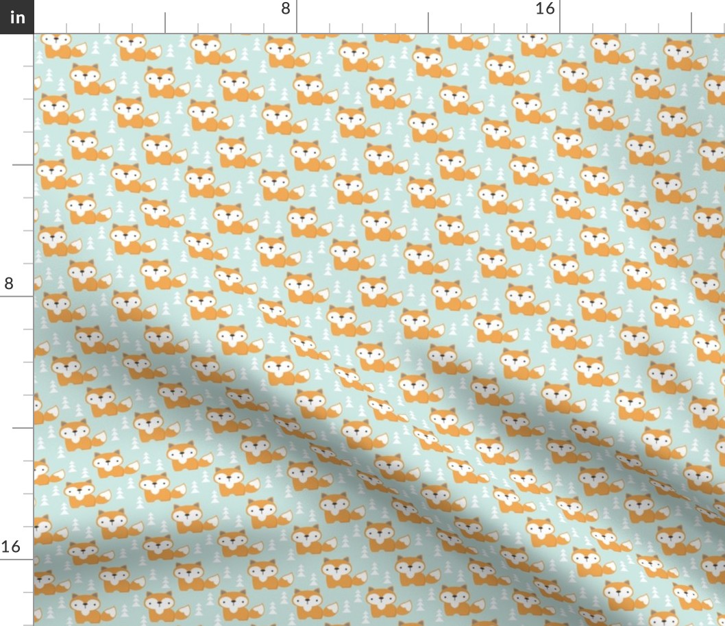 tiny foxes on soft turquoise
