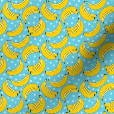 tiny geometric bananas on blue