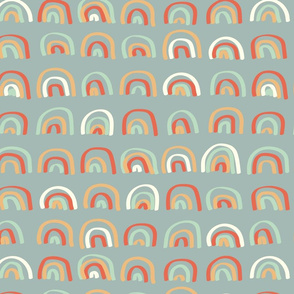 Soft colored rainbows on blue grey background